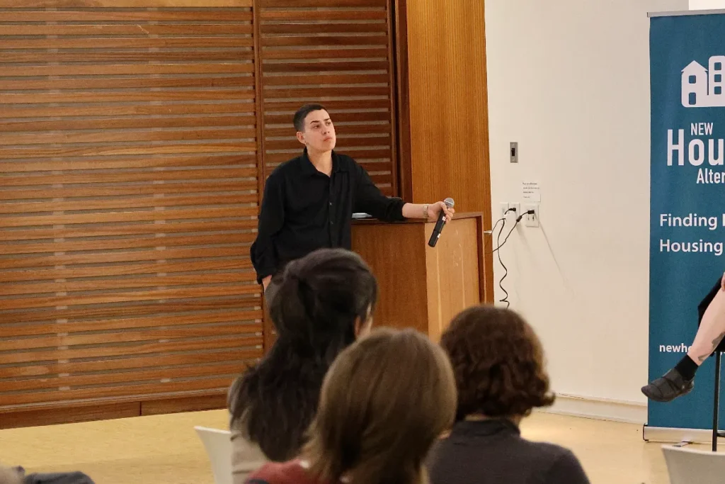 The panel host looks pensive while listening