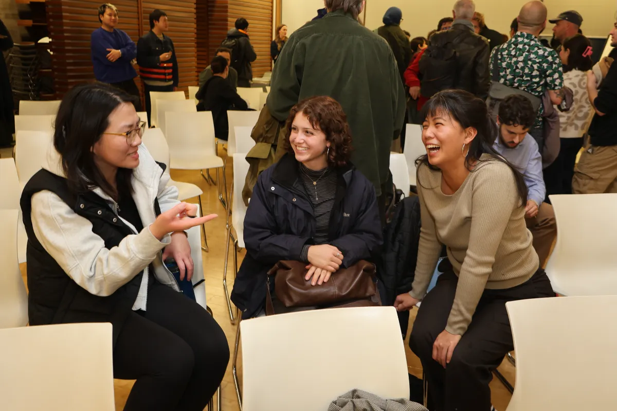 Three young woman laughing and chatting